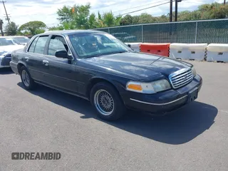 2000 Ford Crown Victoria LX z VIN 2FAFP74W1YX177737, wystawiony jako IAAI lot #42375378 z przebiegiem 90 359 mil mil oraz . Historia ofert i sprzedaży dostępna na DreamBid. Obrazek 1.