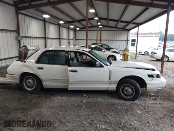 1997 Mercury Grand Marquis GS z VIN 2MELM74W6VX680292, wystawiony jako IAAI lot #42299154 z przebiegiem 208 666 mil mil oraz . Historia ofert i sprzedaży dostępna na DreamBid. Obrazek 12.