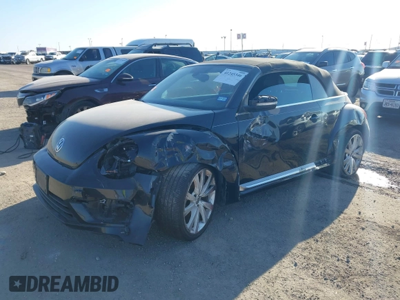 2014 Volkswagen Beetle 1.8T with VIN 3VW517AT4EM815243, listed as a IAAI auction lot 41245346 with 119,259 mi miles and . Bid and sale history available at DreamBid. Image 2.