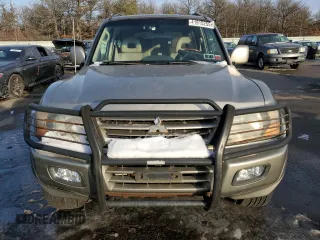 2002 Mitsubishi Montero Limited z VIN JA4MW51R12J020808, wystawiony jako Copart lot #41915255 z przebiegiem 127 834 mil mil oraz Czysty tytuł • Clean title. Historia ofert i sprzedaży dostępna na DreamBid. Obrazek 5.