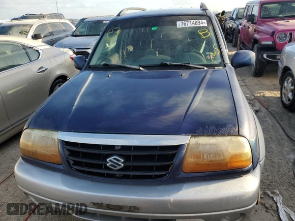 2003 Suzuki Grand Vitara z VIN JS3TE62V534100751, wystawiony jako Copart lot #76714894 z przebiegiem Nie podano mil oraz Nie do naprawy • Non repairable. Historia ofert i sprzedaży dostępna na DreamBid. Obrazek 5.
