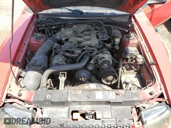 2002 Ford Mustang Deluxe z VIN 1FAFP44472F107630, wystawiony jako Copart lot #56256865 z przebiegiem 214 457 mil mil oraz Szkoda całkowita • Salvage title. Historia ofert i sprzedaży dostępna na DreamBid. Obrazek 11.