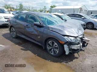 2018 Honda Civic EX-T z VIN 2HGFC1F34JH643975, wystawiony jako IAAI lot #42209799 z przebiegiem 58 684 mil mil oraz . Historia ofert i sprzedaży dostępna na DreamBid. Obrazek 1.