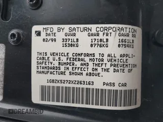 1999 Saturn SL with VIN 1G8ZK5272XZ263163, listed as a IAAI auction lot 42180002 with 138,463 mi miles. Bid and sale history available at carsss.com. Image 9.