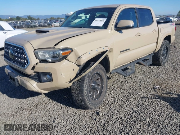 2018 Toyota Tacoma SR z VIN 3TMCZ5AN7JM125425, wystawiony jako IAAI lot #40459066 z przebiegiem 85 182 mil mil oraz . Historia ofert i sprzedaży dostępna na DreamBid. Obrazek 6.