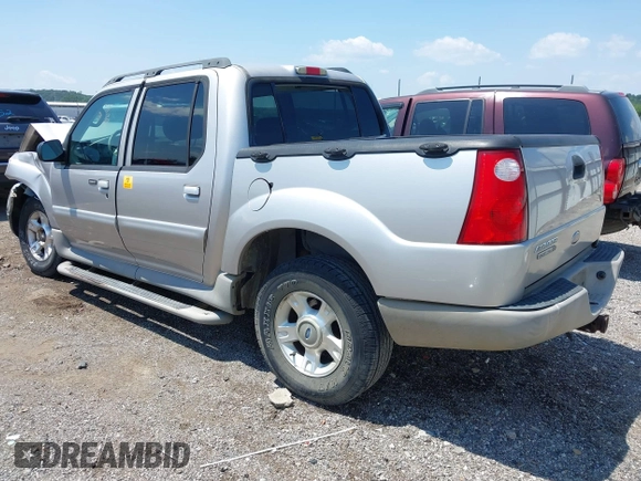 2003 Ford Explorer Sport Trac XLS z VIN 1FMZU67E13UA18239, wystawiony jako IAAI lot #39808663 z przebiegiem 176 641 mil mil oraz . Historia ofert i sprzedaży dostępna na DreamBid. Obrazek 3.