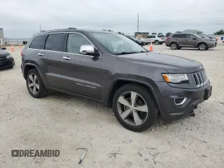 2014 Jeep Grand Cherokee Overland with VIN 1C4RJFCG9EC572237, listed as a Copart auction lot 53864865 with 90,657 mi miles and Salvage Title. Bid and sale history available at DreamBid. Image 4.