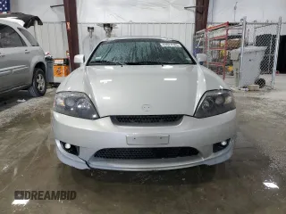 2006 Hyundai Tiburon GT z VIN KMHHN65F96U203924, wystawiony jako Copart lot #43624185 z przebiegiem 120 403 mil mil oraz Szkoda całkowita • Salvage title. Historia ofert i sprzedaży dostępna na DreamBid. Obrazek 5.