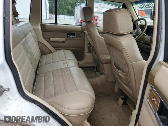 1990 Jeep Grand Wagoneer z VIN 1J4FN78L0LL282169, wystawiony jako Copart lot #59809545 z przebiegiem 194 382 mil mil oraz Czysty tytuł • Clean title. Historia ofert i sprzedaży dostępna na DreamBid. Obrazek 11.