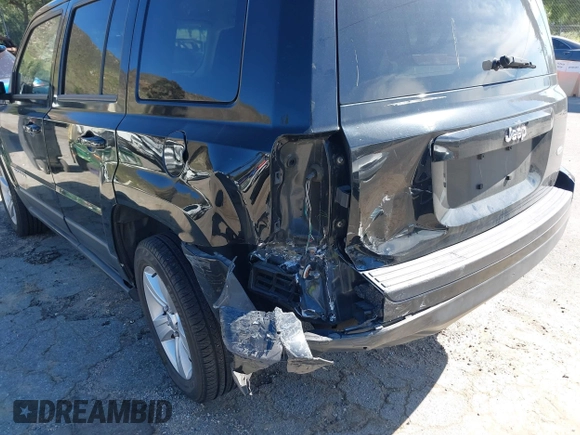 2013 Jeep Patriot Latitude with VIN 1C4NJPFA5DD230031, listed as a IAAI auction lot 41641768 with 153,910 mi miles. Bid and sale history available at carsss.com. Image 6.