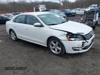 2015 Volkswagen Passat 1.8T Wolfsburg Ed with VIN 1VWAT7A36FC102355, listed as a IAAI auction lot 41728454 with 130,720 mi miles. Bid and sale history available at carsss.com. Image 1.