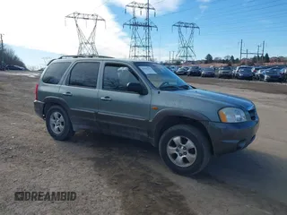 2003 Mazda Tribute ES with VIN 4F2CZ96133KM29066, listed as a IAAI auction lot 41581210 with 265,586 mi miles. Bid and sale history available at carsss.com. Image 1.