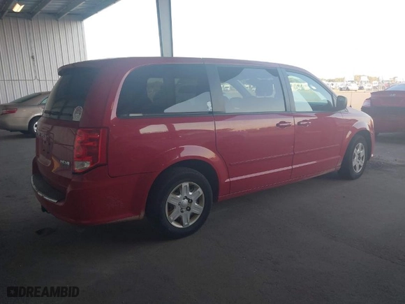 2012 Dodge Grand Caravan SE with VIN 2C4RDGBG0CR157374, listed as a IAAI auction lot 40502846 with 112,079 mi miles. Bid and sale history available at carsss.com. Image 4.
