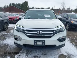 2017 Honda Pilot EX-L with VIN 5FNYF6H52HB015651, listed as a IAAI auction lot 41538814 with 121,433 mi miles and . Bid and sale history available at DreamBid. Image 12.