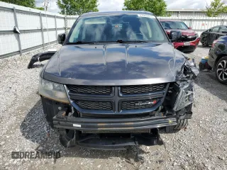2017 Dodge Journey SXT z VIN 3C4PDDBG3HT703935, wystawiony jako Copart lot #57620915 z przebiegiem 126 915 mil mil oraz Szkoda całkowita • Salvage title. Historia ofert i sprzedaży dostępna na DreamBid. Obrazek 5.