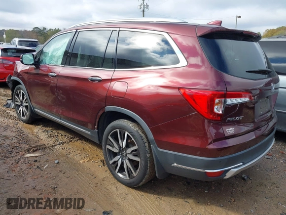 2020 Honda Pilot Touring 8-Passenger with VIN 5FNYF5H94LB012062, listed as a IAAI auction lot 40806740 with 115,431 mi miles and . Bid and sale history available at DreamBid. Image 3.