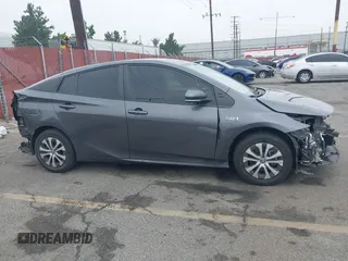 2021 Toyota Prius LE with VIN JTDKAMFP4M3194053, listed as a IAAI auction lot 42441091 with 47,290 mi miles and . Bid and sale history available at DreamBid. Image 14.