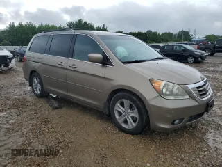 2010 Honda Odyssey Touring z VIN 5FNRL3H97AB082525, wystawiony jako Copart lot #56410845 z przebiegiem 94 819 mil mil oraz Szkoda całkowita • Salvage title. Historia ofert i sprzedaży dostępna na DreamBid. Obrazek 4.