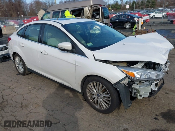 2018 Ford Focus Titanium z VIN 1FADP3J25JL293835, wystawiony jako IAAI lot #41877487 z przebiegiem 109 211 mil mil oraz . Historia ofert i sprzedaży dostępna na DreamBid. Obrazek 3.