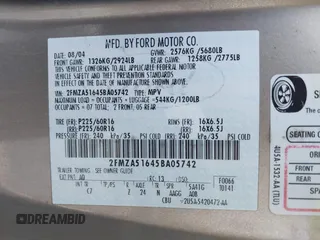 2005 Ford Freestar SE z VIN 2FMZA51645BA05742, wystawiony jako IAAI lot #41429194 z przebiegiem 145 415 mil mil oraz . Historia ofert i sprzedaży dostępna na DreamBid. Obrazek 9.