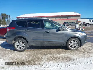 2015 Ford Escape Titanium with VIN 1FMCU9JX6FUB86304, listed as a IAAI auction lot 41595761 with 104,317 mi miles and . Bid and sale history available at DreamBid. Image 13.