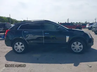 2015 Cadillac SRX with VIN 3GYFNAE33FS522380, listed as a IAAI auction lot 41641899 with 193,818 mi miles and . Bid and sale history available at DreamBid. Image 14.