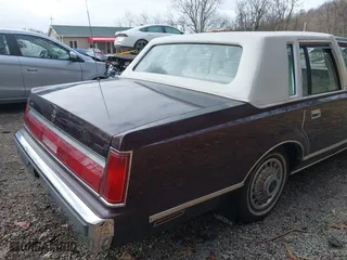 1987 Lincoln Town Car with VIN 1LNBM81F5HY704217, listed as a IAAI auction lot 41855678 with 86,794 mi miles. Bid and sale history available at carsss.com. Image 15.