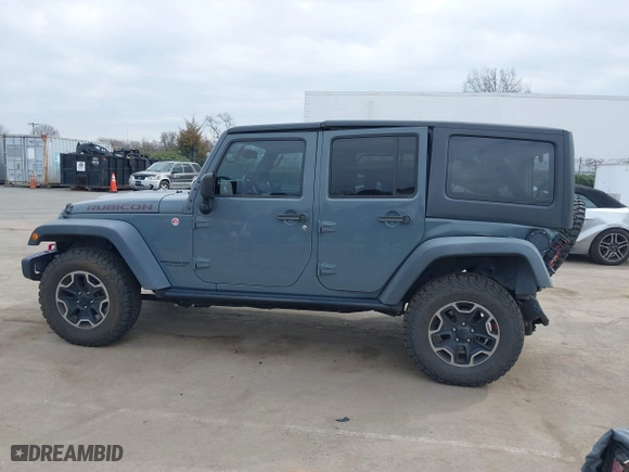 2015 Jeep Wrangler Unlimited Rubicon Hard Rock with VIN 1C4HJWFG1FL679873, listed as a IAAI auction lot 41508722 with 97,165 mi miles. Bid and sale history available at carsss.com. Image 14.