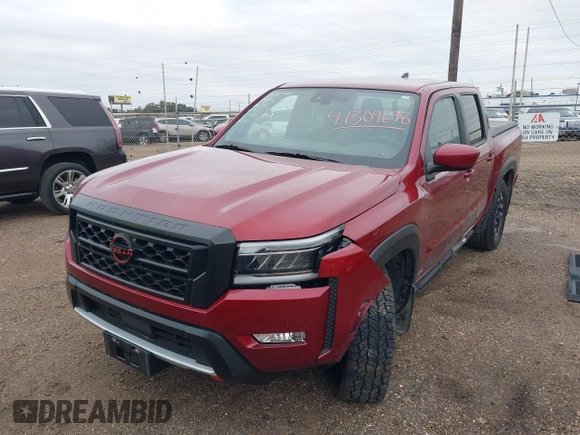 2023 Nissan Frontier Pro-4X z VIN 1N6ED1EK4PN652544, wystawiony jako IAAI lot #41309698 z przebiegiem 26 173 mil mil oraz . Historia ofert i sprzedaży dostępna na DreamBid. Obrazek 2.