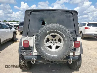 2004 Jeep Wrangler Sport z VIN 1J4FA49SX4P802341, wystawiony jako Copart lot #62752565 z przebiegiem 150 197 mil mil oraz Szkoda całkowita • Salvage title. Historia ofert i sprzedaży dostępna na DreamBid. Obrazek 6.