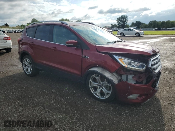 2019 Ford Escape Titanium with VIN 1FMCU0J98KUC00873, listed as a Copart auction lot 61674305 with 53,554 mi miles and Salvage title. Bid and sale history available at DreamBid. Image 4.