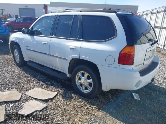 2006 GMC Envoy SLT with VIN 1GKDS13S062128531, listed as a IAAI auction lot 41458983 with 119,385 mi miles. Bid and sale history available at carsss.com. Image 3.