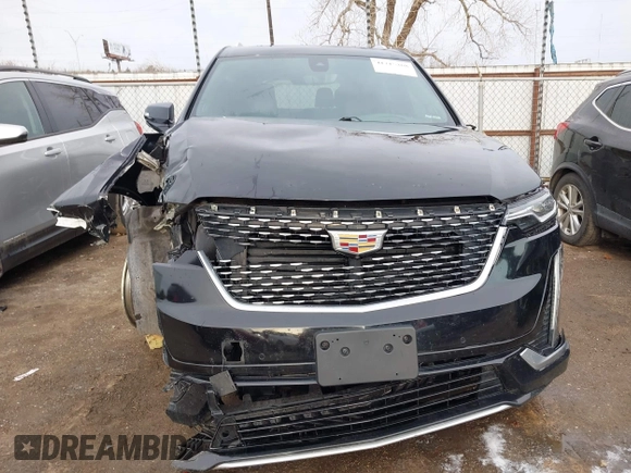 2021 Cadillac XT6 Premium Luxury z VIN 1GYKPDRS9MZ120150, wystawiony jako IAAI lot #41715368 z przebiegiem 47 835 mil mil oraz . Historia ofert i sprzedaży dostępna na DreamBid. Obrazek 13.