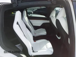 2023 Tesla Model X with VIN 7SAXCBE54PF384403, listed as a IAAI auction lot 40947187 with 16,881 mi miles and . Bid and sale history available at DreamBid. Image 8.