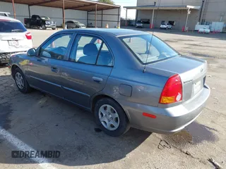 2004 Hyundai Accent GL with VIN KMHCG45C04U531177, listed as a IAAI auction lot 41526033 with 126,102 mi miles. Bid and sale history available at carsss.com. Image 3.