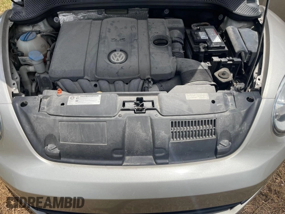 2013 Volkswagen Beetle 2.5L with VIN 3VW5X7AT2DM825928, listed as a Copart auction lot 66500855 with 48,795 mi miles and Salvage title. Bid and sale history available at DreamBid. Image 7.