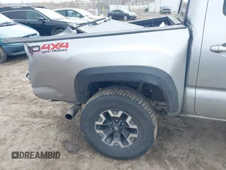 2023 Toyota Tacoma 4WD SR with VIN 3TMCZ5AN0PM609672, listed as a IAAI auction lot 41830191 with 24,244 mi miles. Bid and sale history available at carsss.com. Image 6.