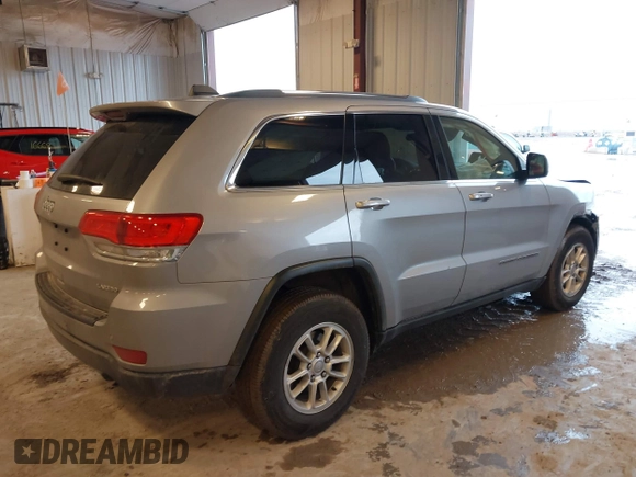 2019 Jeep Grand Cherokee Laredo E with VIN 1C4RJFAG8KC823814, listed as a IAAI auction lot 41728782 with 120,695 mi miles. Bid and sale history available at carsss.com. Image 4.