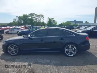2014 Audi S6 Prestige z VIN WAUF2AFC9EN058417, wystawiony jako IAAI lot #42236333 z przebiegiem 58 257 mil mil oraz . Historia ofert i sprzedaży dostępna na DreamBid. Obrazek 15.