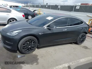 2018 Tesla Model 3 Long Range Battery with VIN 5YJ3E1EA7JF012249, listed as a IAAI auction lot 41782972 with 103,412 mi miles. Bid and sale history available at carsss.com. Image 13.