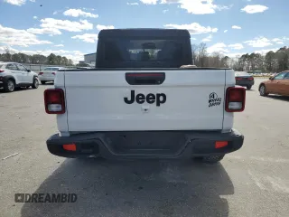 2023 Jeep Gladiator Sport S with VIN 1C6HJTAG4PL556387, listed as a Copart auction lot 47453305 with 35,611 mi miles and Salvage title. Bid and sale history available at DreamBid. Image 6.