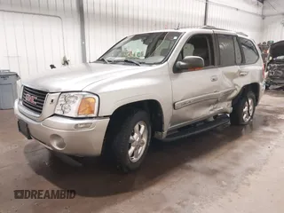 2004 GMC Envoy SLE with VIN 1GKDT13S042243883, listed as a IAAI auction lot 41795335 with 162,873 mi miles. Bid and sale history available at carsss.com. Image 18.