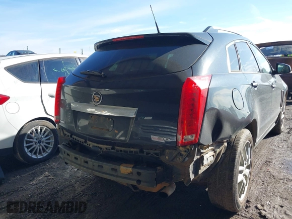 2014 Cadillac SRX Premium Collection z VIN 3GYFNDE34ES581728, wystawiony jako IAAI lot #41578226 z przebiegiem 121 118 mil mil oraz . Historia ofert i sprzedaży dostępna na DreamBid. Obrazek 6.