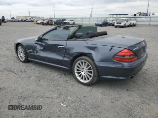 2008 Mercedes-Benz SL 550 with VIN WDBSK71FX8F141468, listed as a Copart auction lot 61036285 with 109,698 mi miles and Salvage title. Bid and sale history available at DreamBid. Image 2.