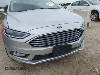 2017 Ford Fusion SE z VIN 3FA6P0HD5HR166433, wystawiony jako IAAI lot #42394998 z przebiegiem 121 333 mil mil oraz . Historia ofert i sprzedaży dostępna na DreamBid. Obrazek 6.