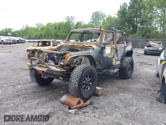 2012 Jeep Wrangler Unlimited Sahara with VIN 1C4BJWEG0CL167797, listed as a IAAI auction lot 42331710 with Not provided miles and . Bid and sale history available at DreamBid. Image 2.