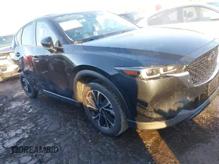 2022 Mazda CX-5 2.5 S Premium Plus Package with VIN JM3KFBEM3N0641222, listed as a IAAI auction lot 41303984 with 26,112 mi miles. Bid and sale history available at carsss.com. Image 1.