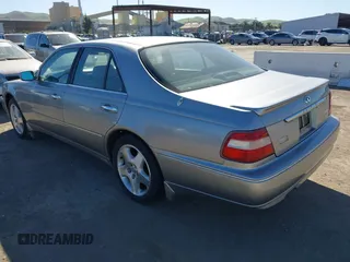 1999 Infiniti Q45 z VIN JNKBY31A8XM603290, wystawiony jako IAAI lot #41668113 z przebiegiem 144 251 mil mil oraz . Historia ofert i sprzedaży dostępna na DreamBid. Obrazek 3.