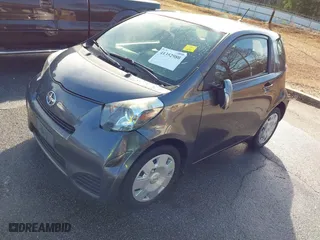 2014 Scion iQ with VIN JTNJJXB00EJ030409, listed as a IAAI auction lot 41352980 with 176,739 mi miles. Bid and sale history available at carsss.com. Image 2.