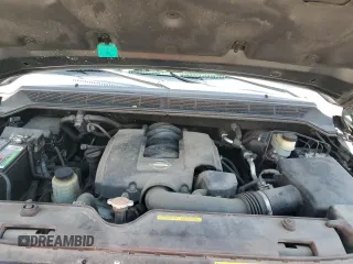 2006 Nissan Titan SE z VIN 1N6BA06A66N569501, wystawiony jako Copart lot #59872455 z przebiegiem 80 057 mil mil oraz Szkoda całkowita • Salvage title. Historia ofert i sprzedaży dostępna na DreamBid. Obrazek 11.